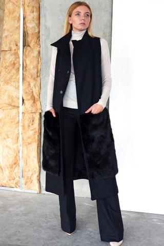 The Rococo Vest Coat is a long double breasted vest coat and has deep patch pockets cut from faux fur. The asymmetrical collar keeps the neckline fresh.