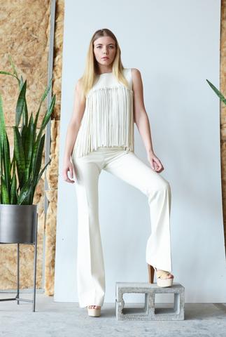 The fringe skirt is we think fringe should be done! Two layers of faux leather hand cut fringe is woven on to the waist band.