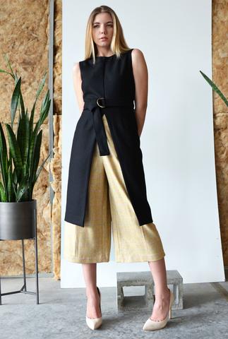 The Kiki Tunic is made from a coating wool, and has a long opening in the front. The belt with gold hardware adds just a touch of interest.